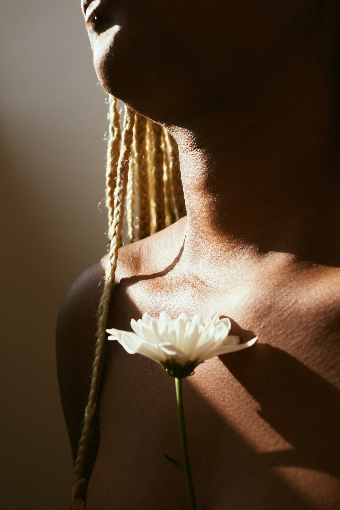 Portrait of Woman with Flowers and Dramatic Lighting